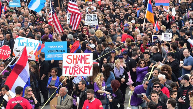 Crowd of Armenian people with signs protesting the genocide by Turkey in 2015