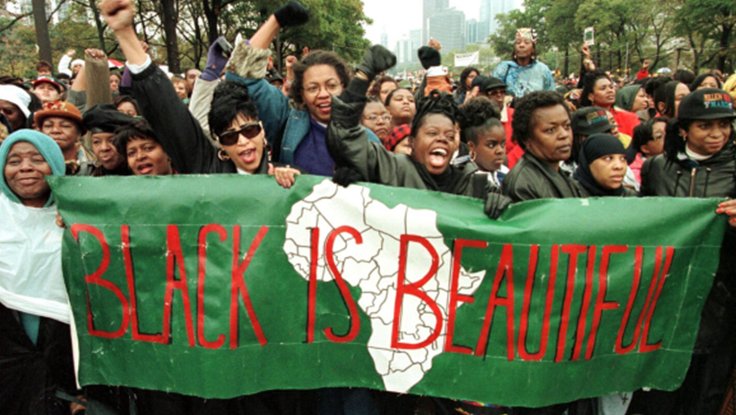 Black Women Marching for family unity and African American women with a Black is Beautiful Sign on Benjamin Benjamin Franklin Parkway in Philadelphia, Pennsylvania in 1997