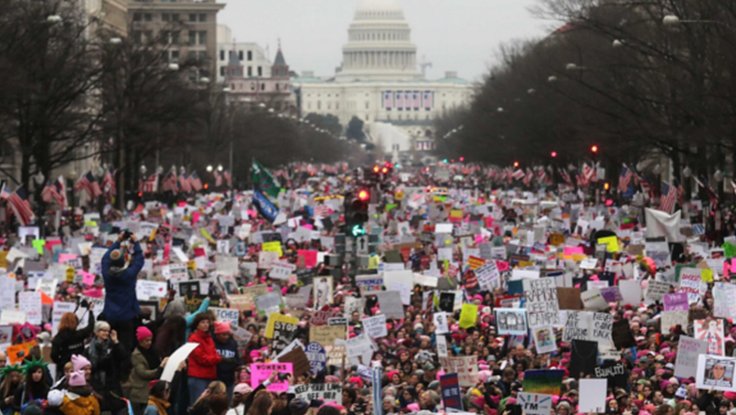 First Year of Women's March on Washington D.C. in 2017 at Capitol with crowd of women protesting with signs
